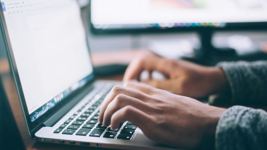 Person working on a website redesign on a laptop
