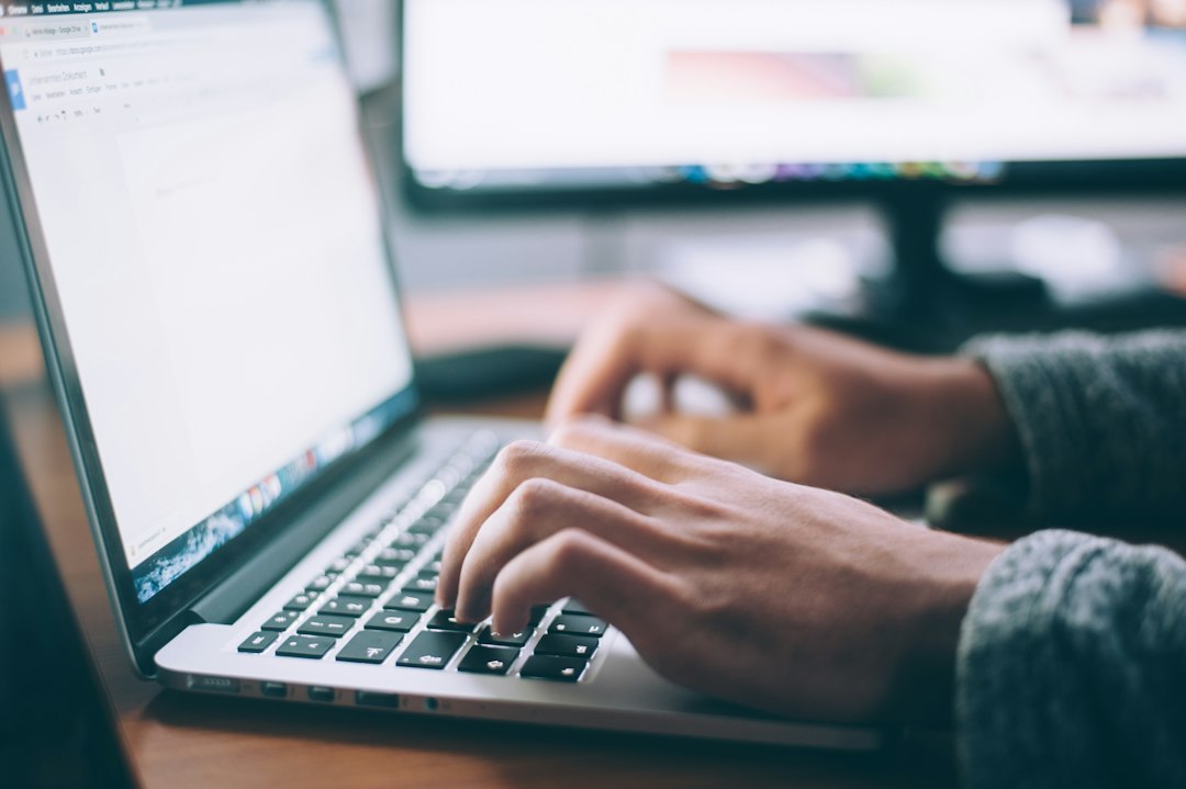 Person working on a website redesign on a laptop