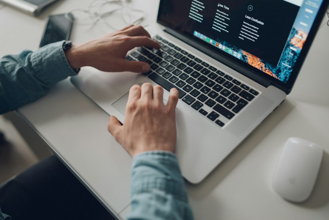 Merchant managing an online store on a laptop