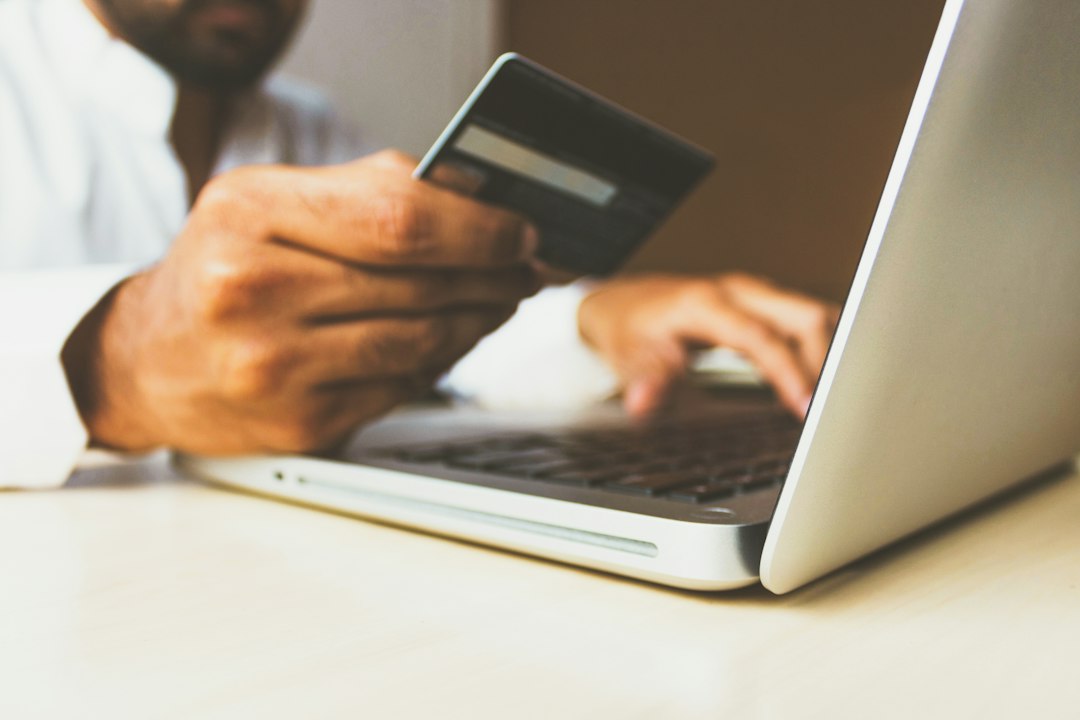 Shopper paying with a credit card on a laptop in an online store found through Google search