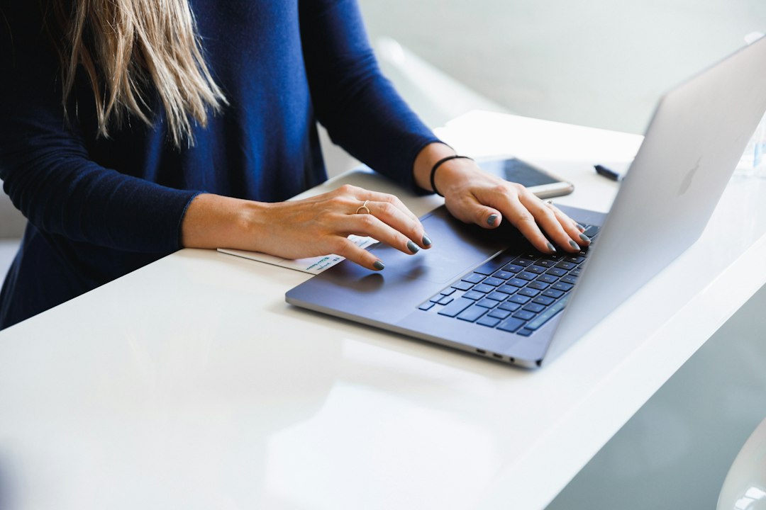 Marketer working on a laptop to build a high-converting landing page