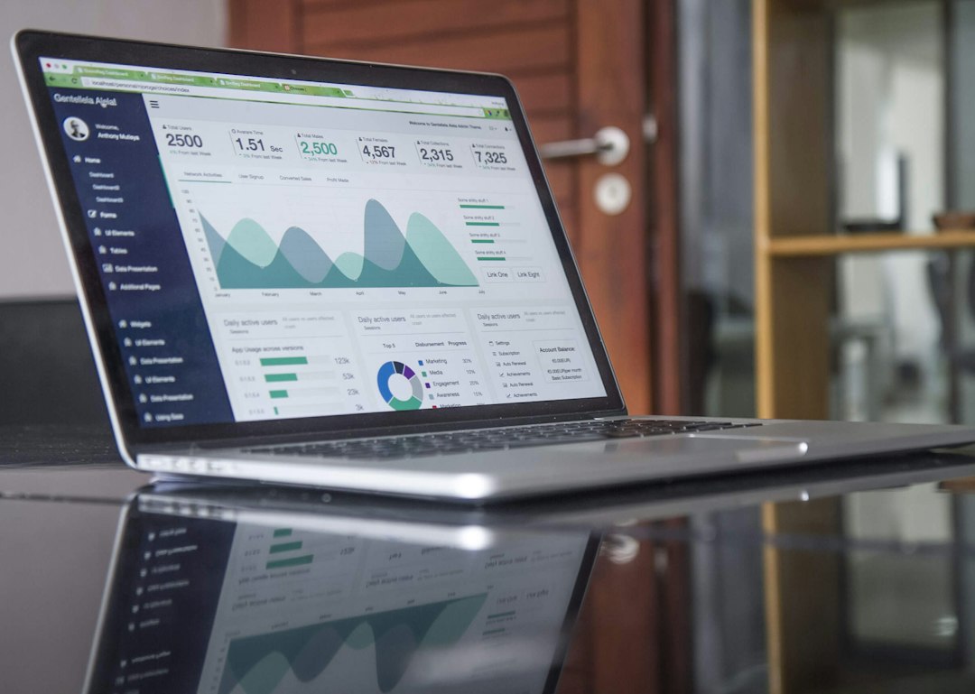 Laptop showing website traffic statistics, illustrating SEO costs and results for Canadian businesses