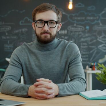 Entrepreneur at a desk choosing a web design agency
