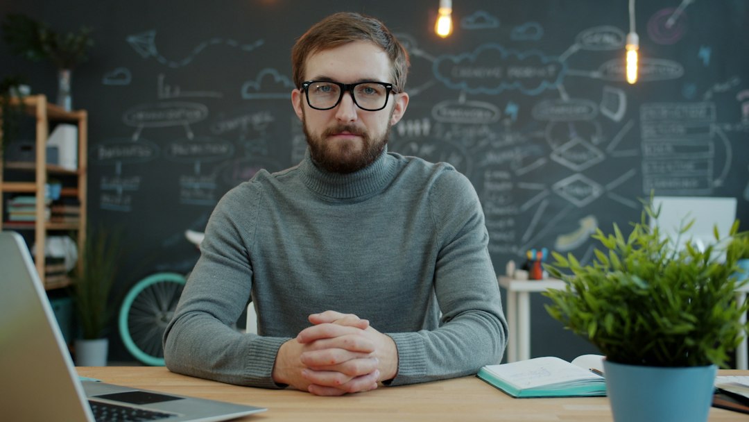 Entrepreneur at a desk choosing a web design agency