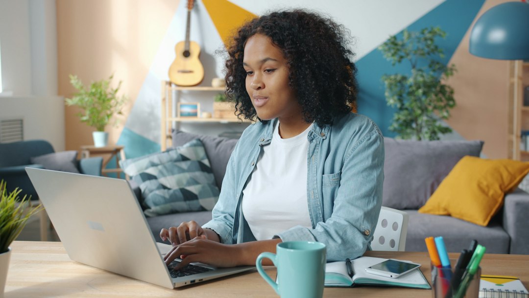 Business owner celebrating online success on a laptop